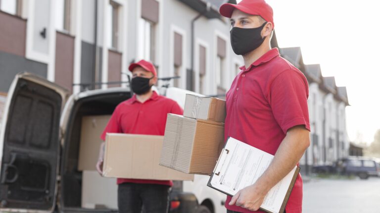 Professional packers carefully packing household items in Preet Vihar
